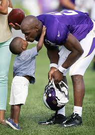 Adrian Peterson and son